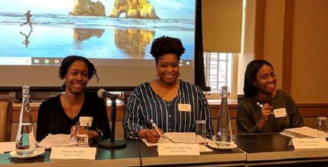 The Mellon Mays Undergraduate Fellowship. Three people sitting at a table with microphones smile for the camera.