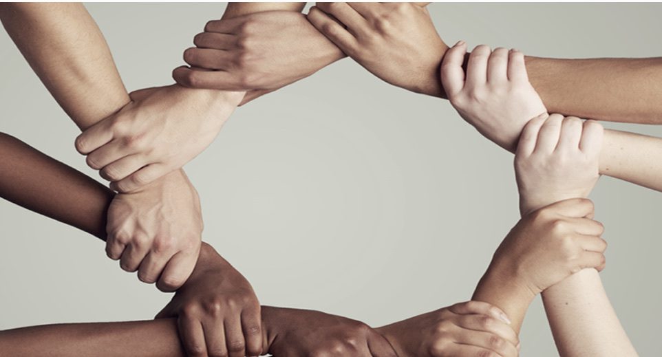 Holding hands in a circle. Holding hands in a circle.