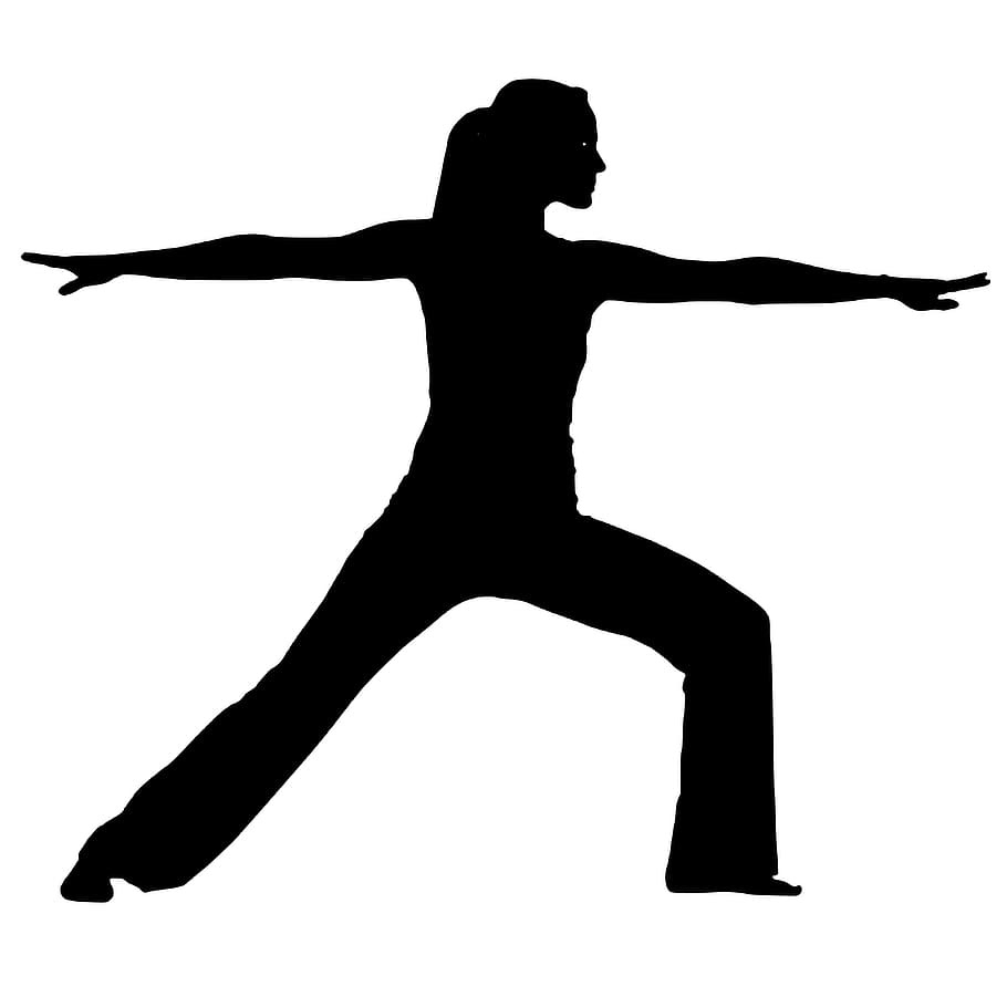 A silhouette of a person performing Pilates.
