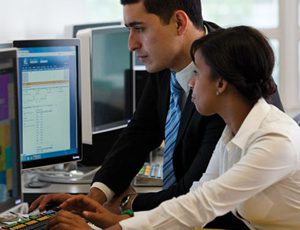 BBA Application Two people working at a computer together.