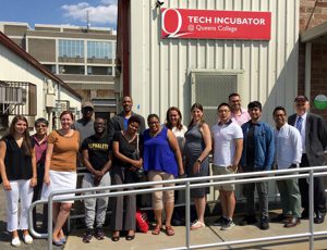 Tech Incubator A group of people standing out the Tech Incubator.