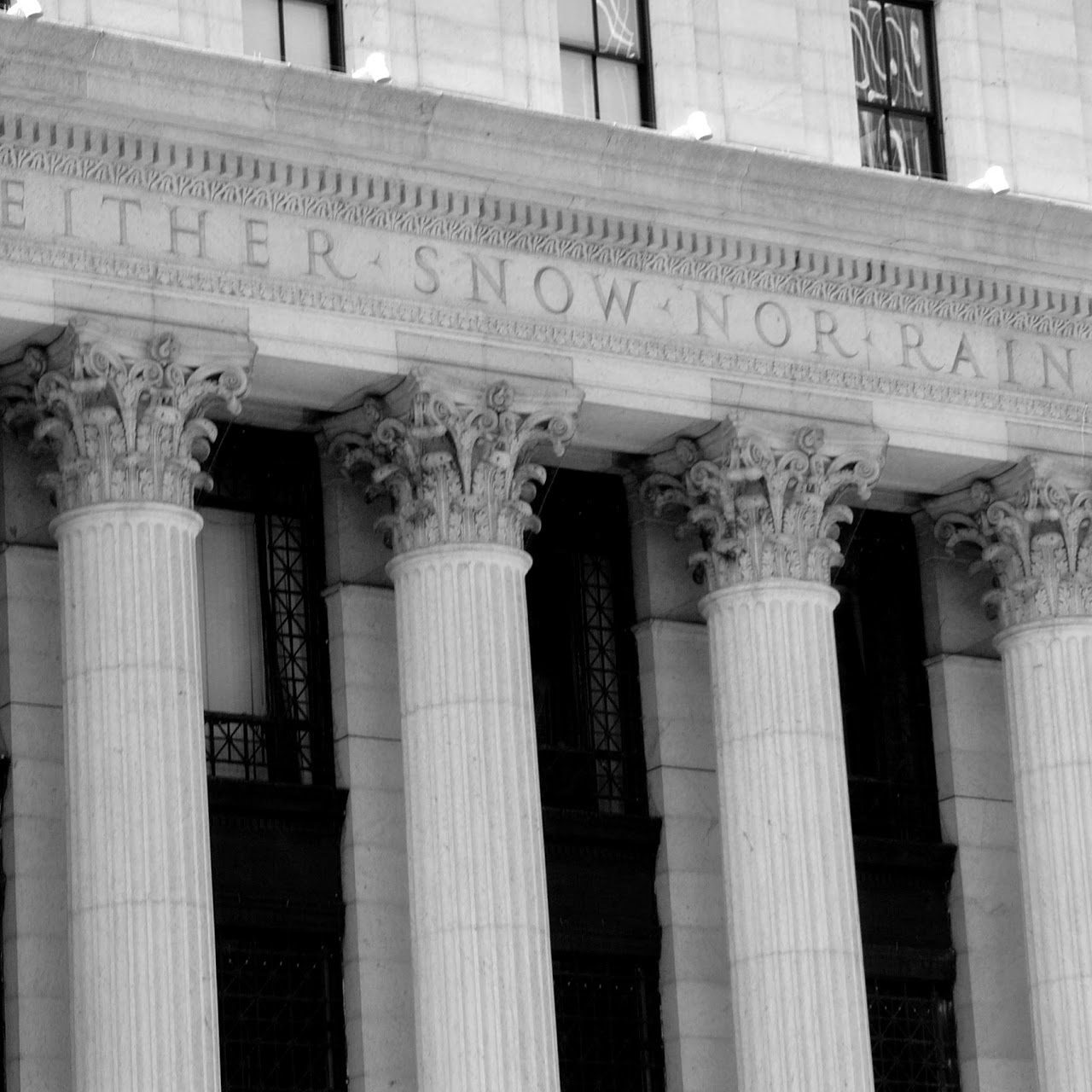 Black and white image of columns on a building.