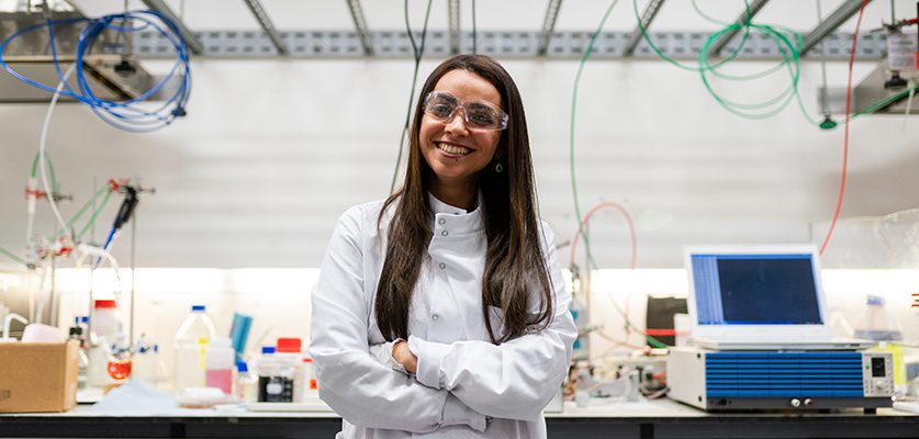 Female chemical engineer in laboratory develops clean energy storage solutions