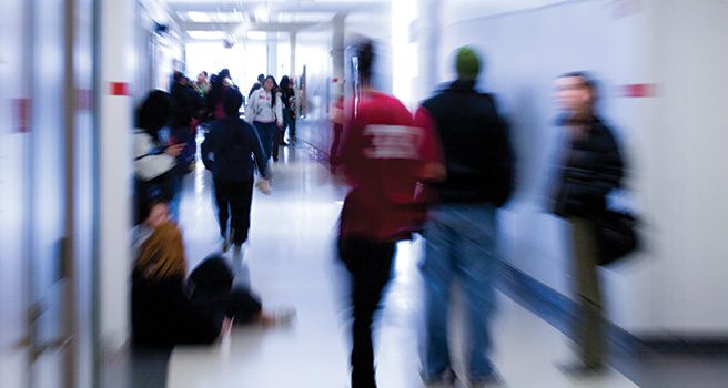 Students walking through a hallway.