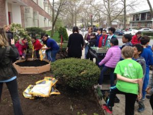 A team of people planting a garden.