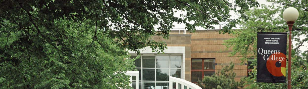 Outside photo of a building at Queens College. Outside photo of a building at Queens College.