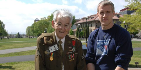 Justin Apperson is pictured here at a campus veteran alumni memorial dedication ceremony with fellow alum Arnold Franco who served with distinction in World War II and funded the memorial.