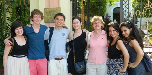 Seven people stand side-by-side.