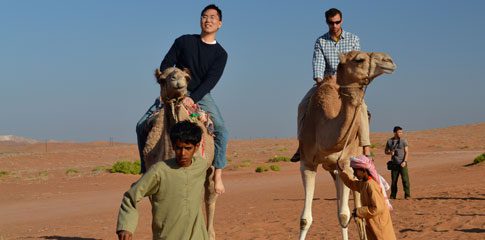 Daniel Kong riding a camel during his semester abroad in the college’s new Arabic language program in Muscat.