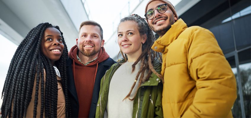 Four people smiling for the camera.