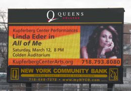 A view of a Queens College billboard featuring a performance at the Colden Auditorium.