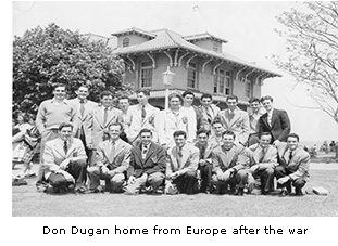 Two rows of men posing for a photograph at Queens College. The caption reads “Don Dugan home from Europe after the war”.  