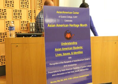 A view of the Asian American Heritage Month poster in front of one of the tables.