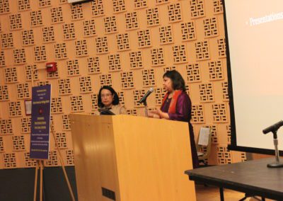 Prof. Madhulika Khandelwal, Director of AAC talking into a microphone on a podium.