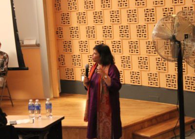 Prof. Madhulika Khandelwal, Director of AAC holding and talking into a microphone.