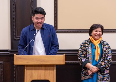 Stephen speaking at a podium.
