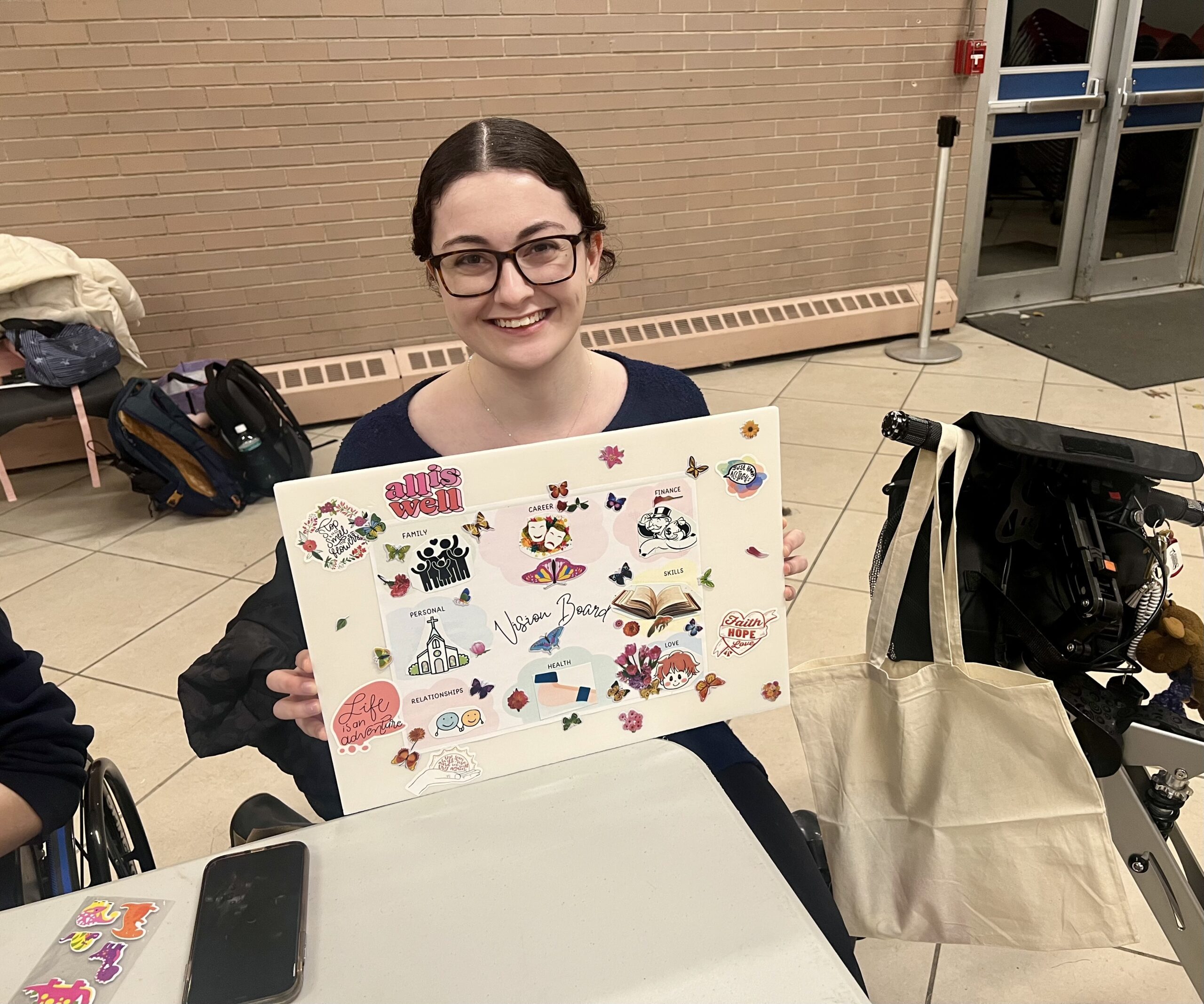 A student showing her artwork at a LEADS workshop