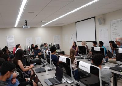 View from one of the student’s perspective from the right-hand side of the classroom, looking at the presenters in front of the room.