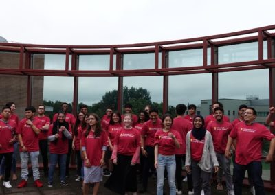 Group photo of Cohort 1. Most of the participants are laughing or smiling.