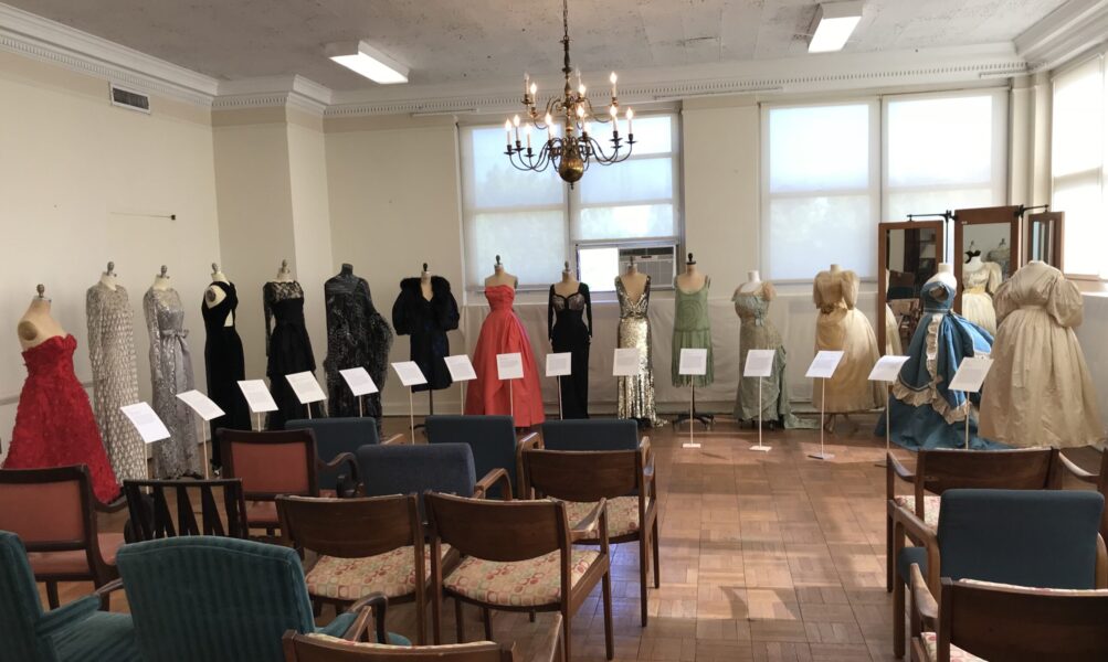 Image of an exhibit of gowns from various time periods from the mid 1800s to the 2000s.