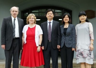 People standing side-by-side. From left to right: Dr. Howard Kleinmann, Provost Hendrey, Vice President Sun Yuedong, Dean Liu Qin (who succeeded Lyu Le), and Prof. Yu Yiqi (USST Joint Program Coordinator)