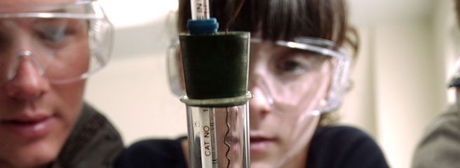 Students Looking at a Microscope