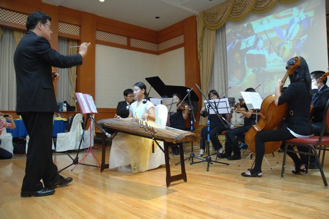 A group of people playing instruments.