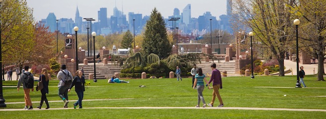 People walking through Queens College Campus.