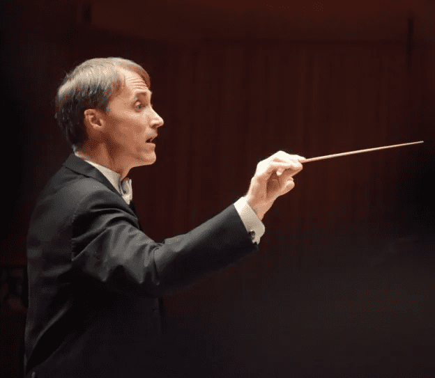james-john-with-baton James John, Professor and Director of Choral Studies