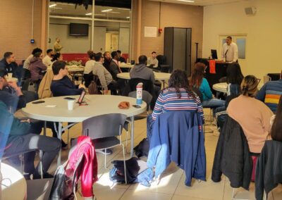 QC Business Breakfast with a full room full of students