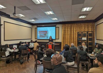 Caitlin King presents to a full room.