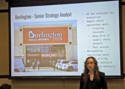 Caitlin King presents to a completely full business breakfast.