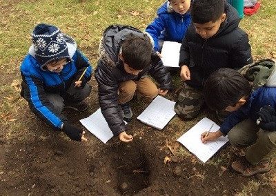 Students characterizing soils in depth.