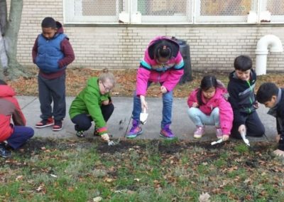 Grabbing soil samples on the school grounds.