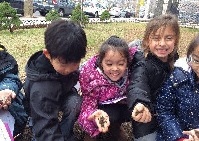 Students holding soil. Who thought that soils could be so much fun?