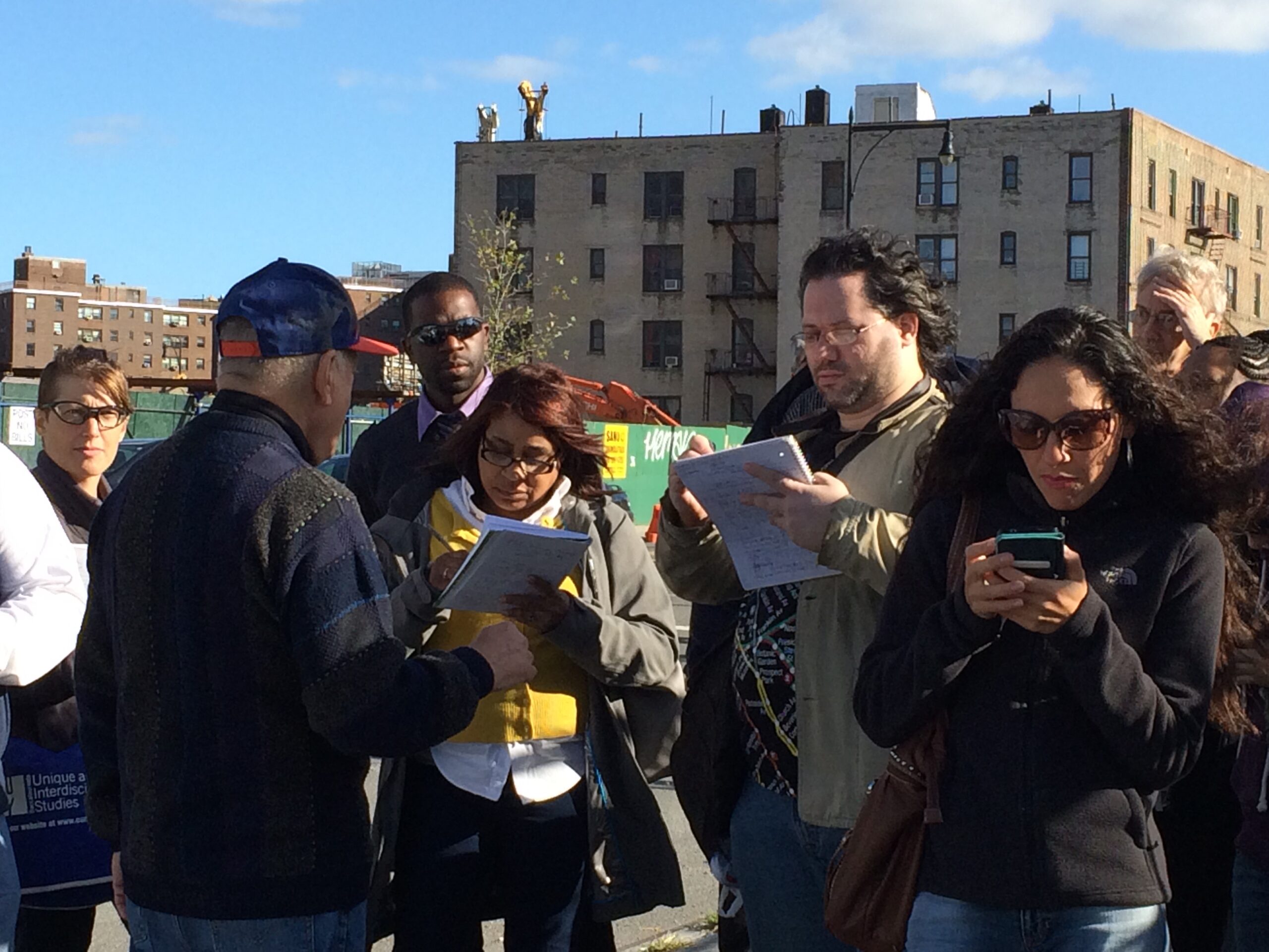 Group of people taking notes.