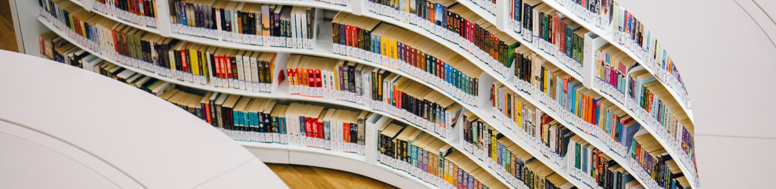 curved bookshelves in library