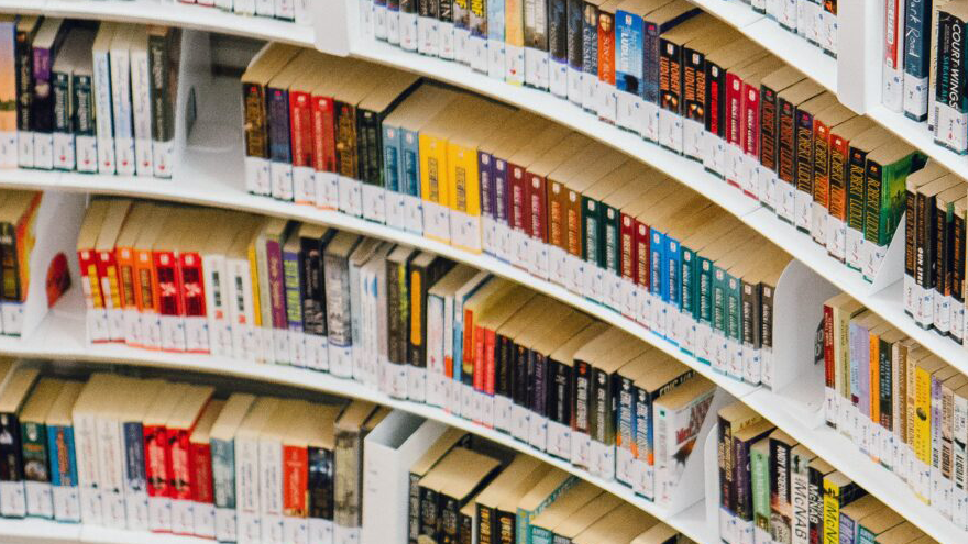 curved bookshelves in library