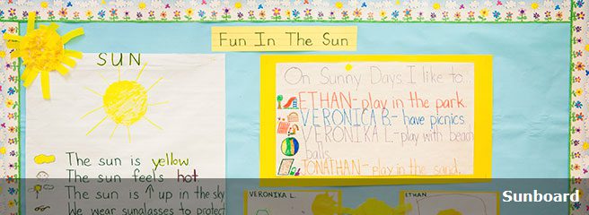 A corkboard featuring writings about the sun from the students.