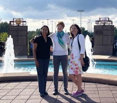 Schiro Withanachchi, Vivian Carstensen (Germany), and Zadia Feliciano standing in front of a fountain