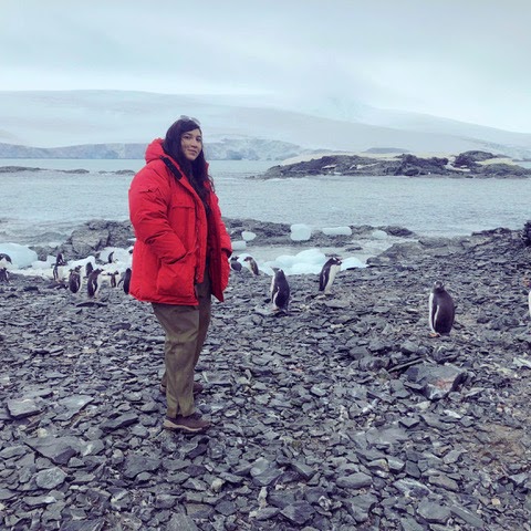 Jacqueline Sarmiento Jacqueline Sarmiento in Antarctica with penguins visible in the background.