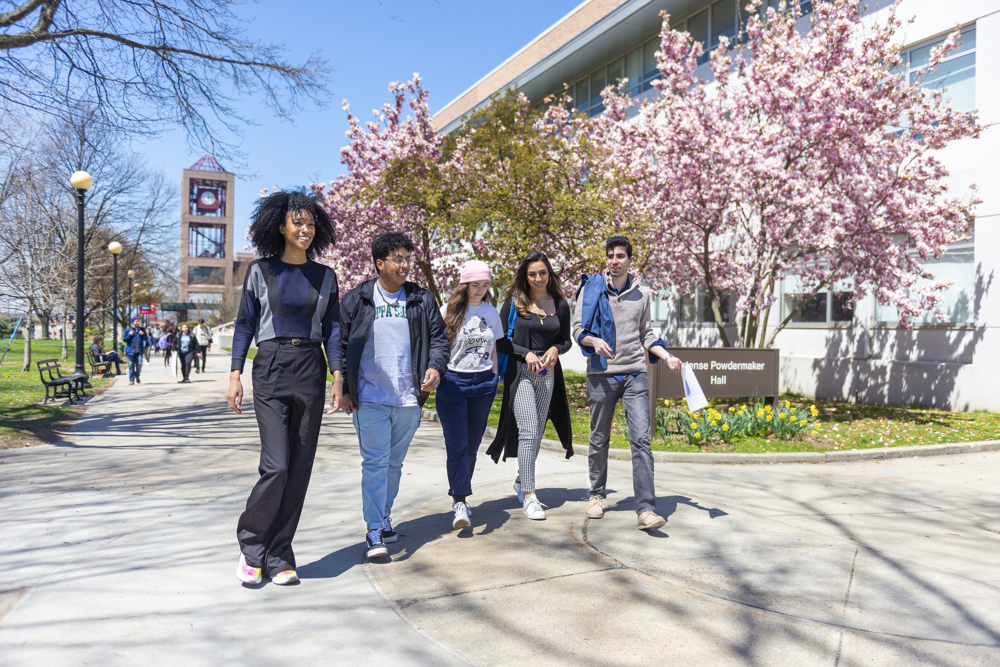 Students walking through the Queens College campus.