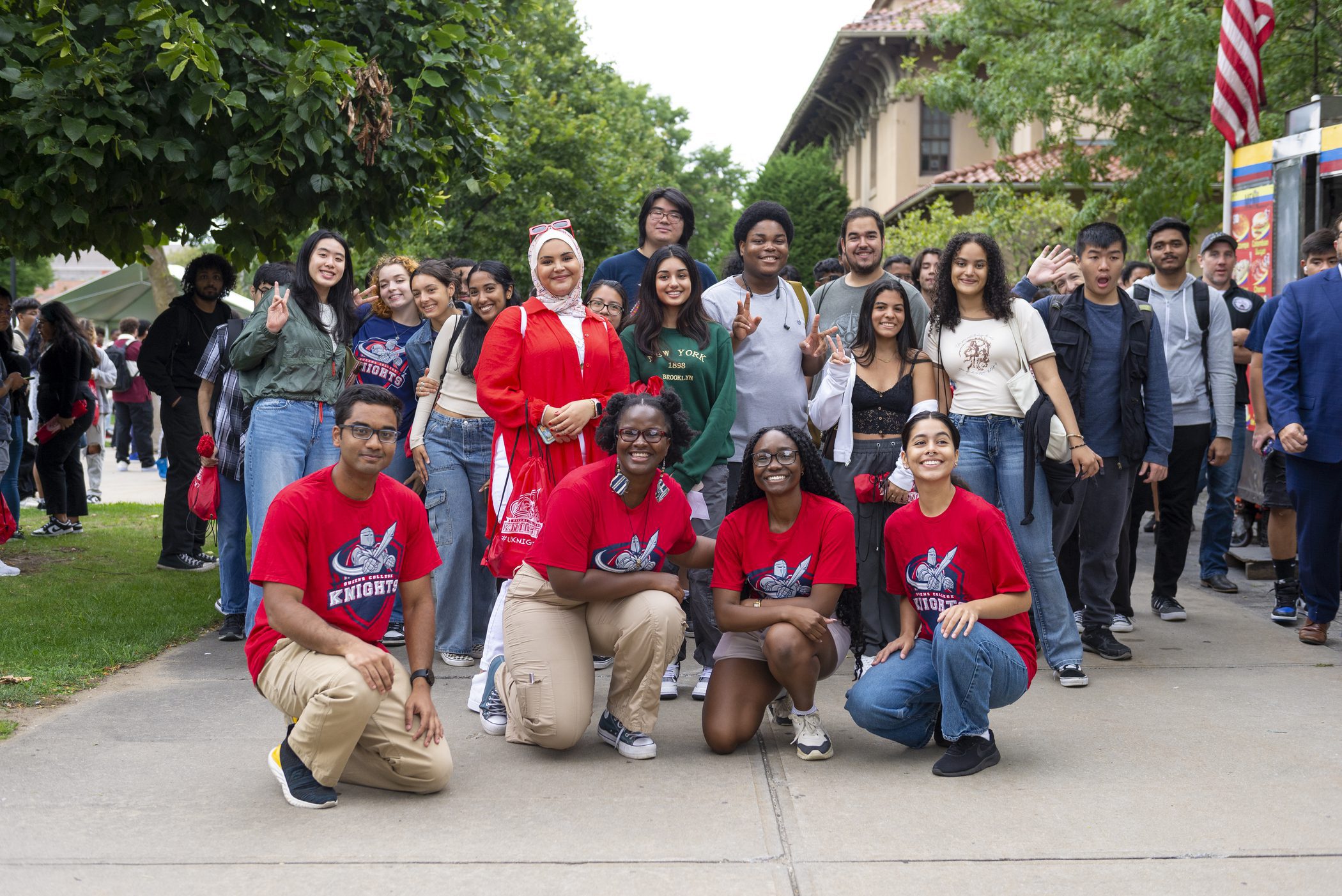 Students walking through the Queens College campus.
