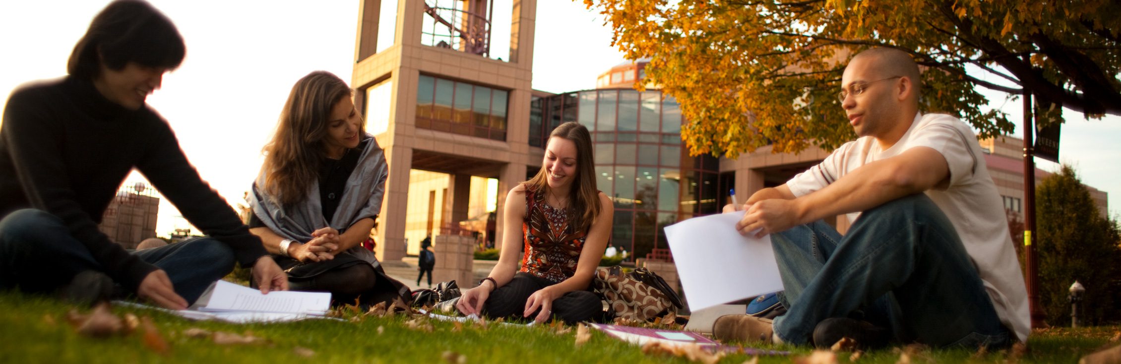 Students walking through the Queens College campus.