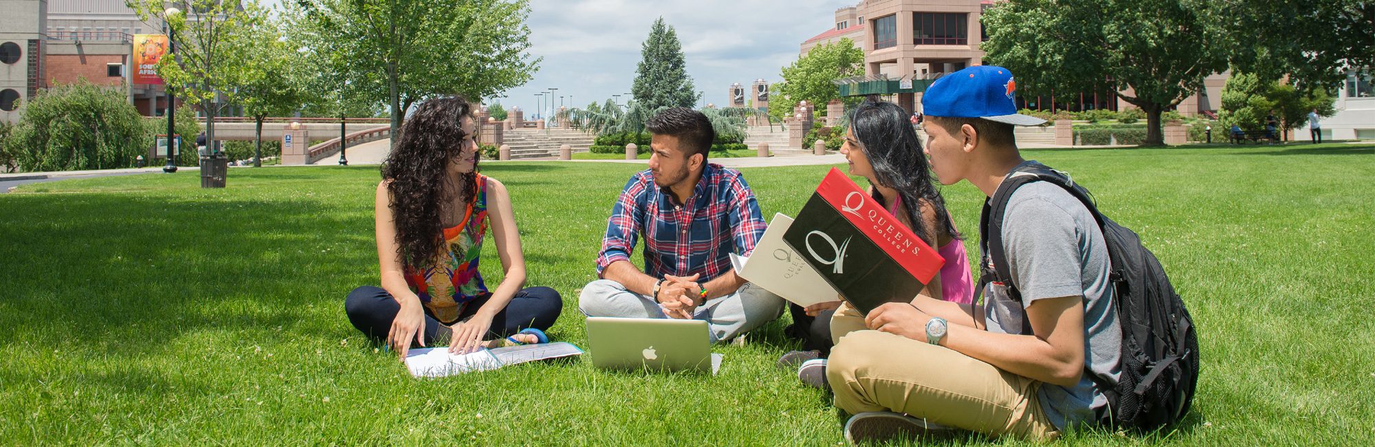 Students walking through the Queens College campus.
