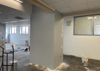 Room renovations with equipment and paint buckets.