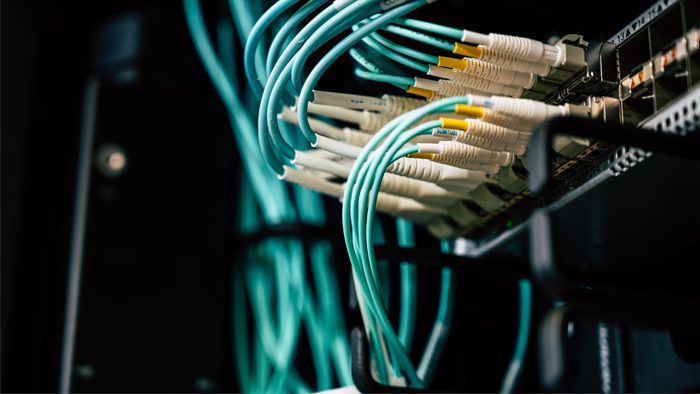 Network Services Light blue cables connected to a server.