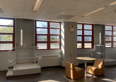 Two chairs around a table.