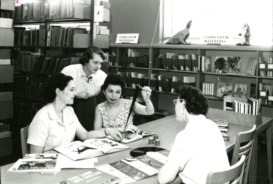 Students Viewing Microfilm in Paul Klapper Library
