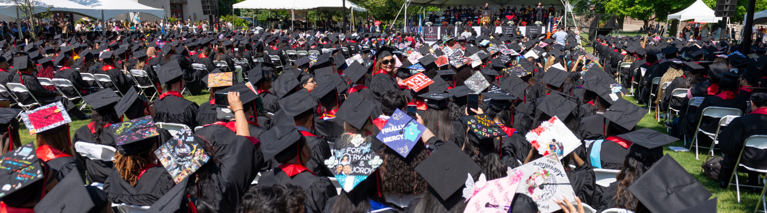 view of the stage on Commencement day and photo of Jon Favreau receiving his degree